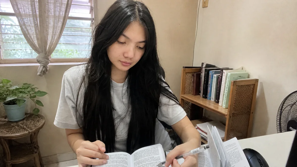 Participant 2 studying in a tropical home
